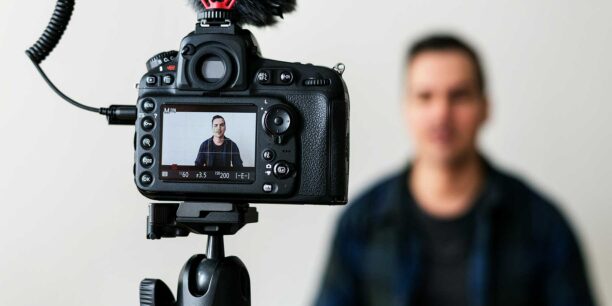 A person filming a video