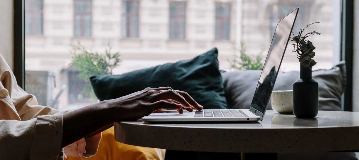woman typing on laptop