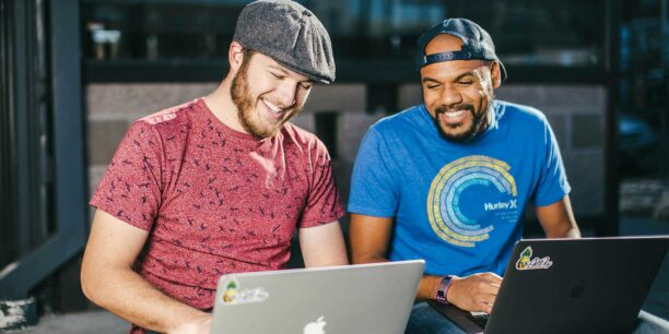 Two coworkers working on their LinkedIn nonprofit account