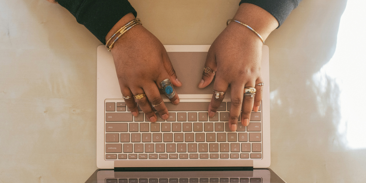 Person writing a sponsorship letter on their laptop
