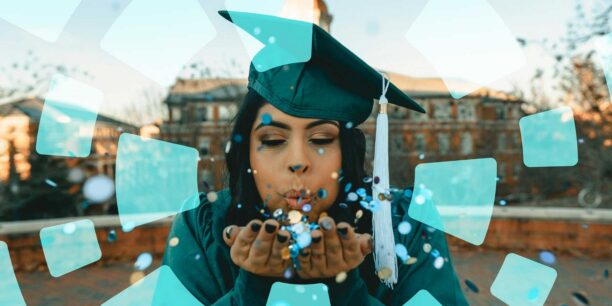 A graduate blowing confetti out of her palm