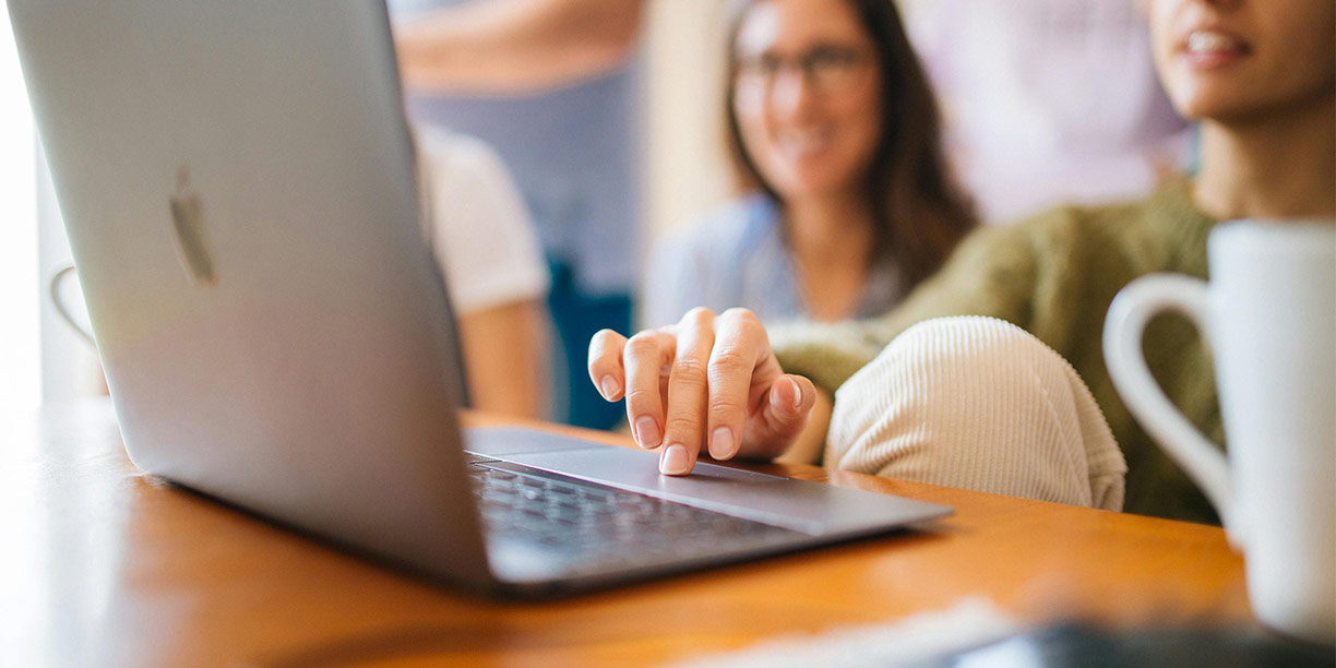People sitting at a desk evaluating their nonprofit marketing metrics