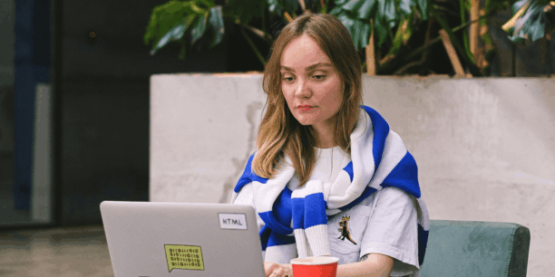 women staring at a laptop screen