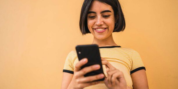 person filling out a survey on her phone