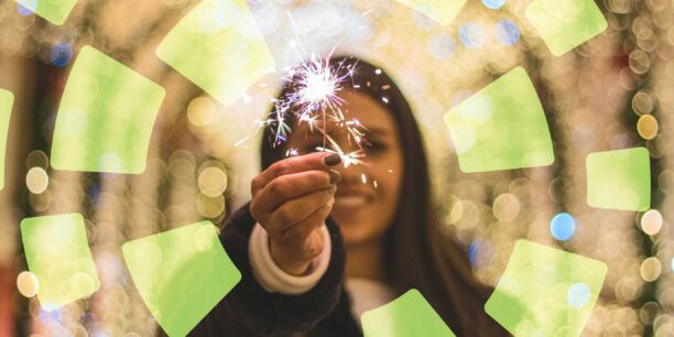 A woman holding a sparkler